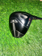 Golf club head with 'TSR4' branding on a grass background